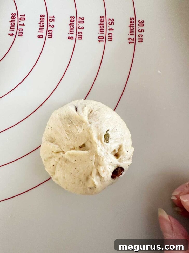 Forming the dough pieces into balls.