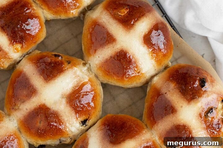 Traditional hot cross buns on cooling rack.