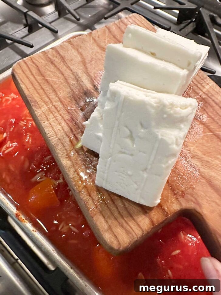 Slabs of feta cheese ready to be added on top of the orzo mixture.