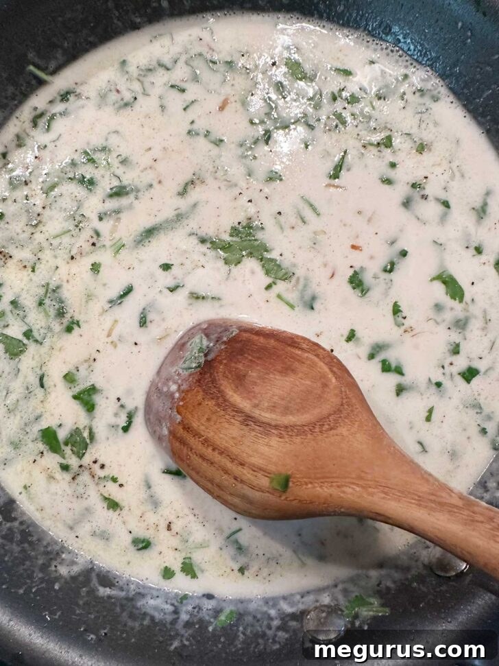 Coconut lime sauce simmering gently in the skillet.