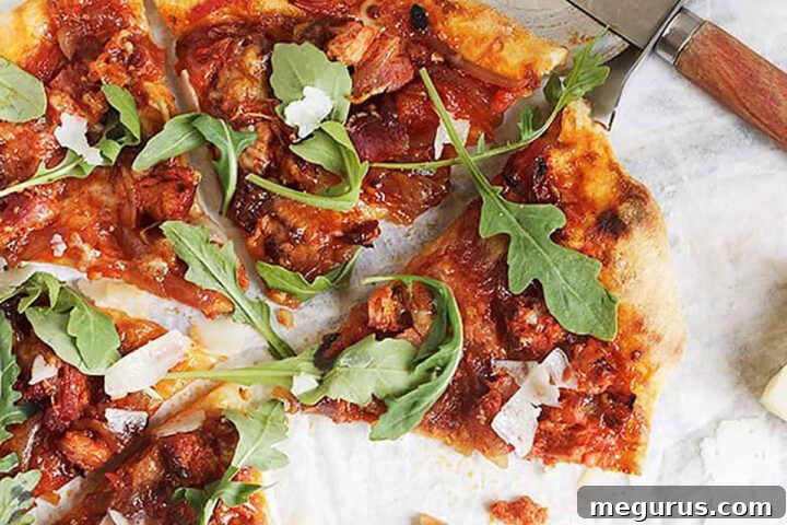 manchego chorizo pizza sliced on parchment