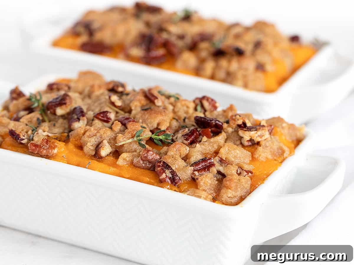 Roasted Butternut Squash Casserole in serving dishes, showcasing its golden brown topping and vibrant interior.