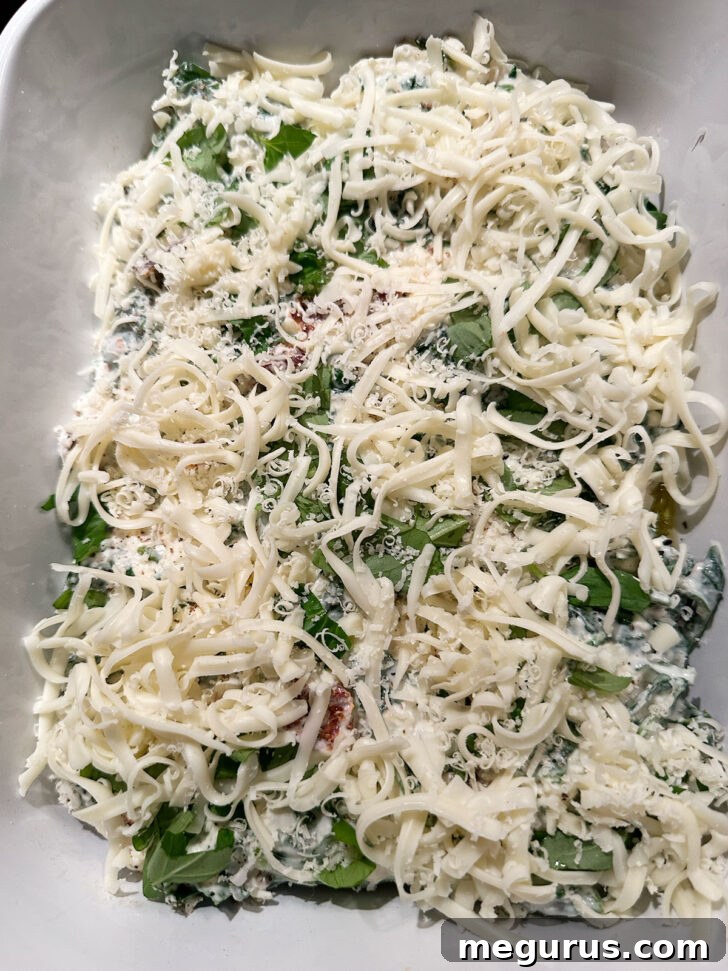 Shredded mozzarella added to the top of the Tuscan chicken.