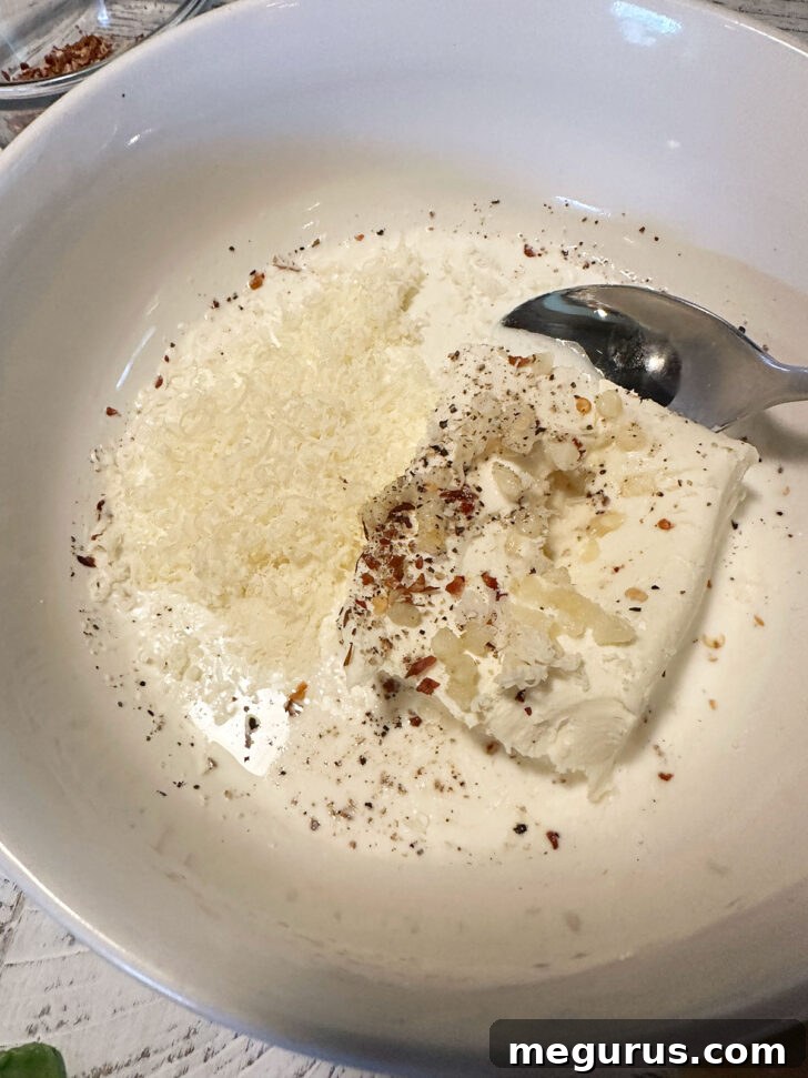 Cream cheese topping ingredients in a bowl.