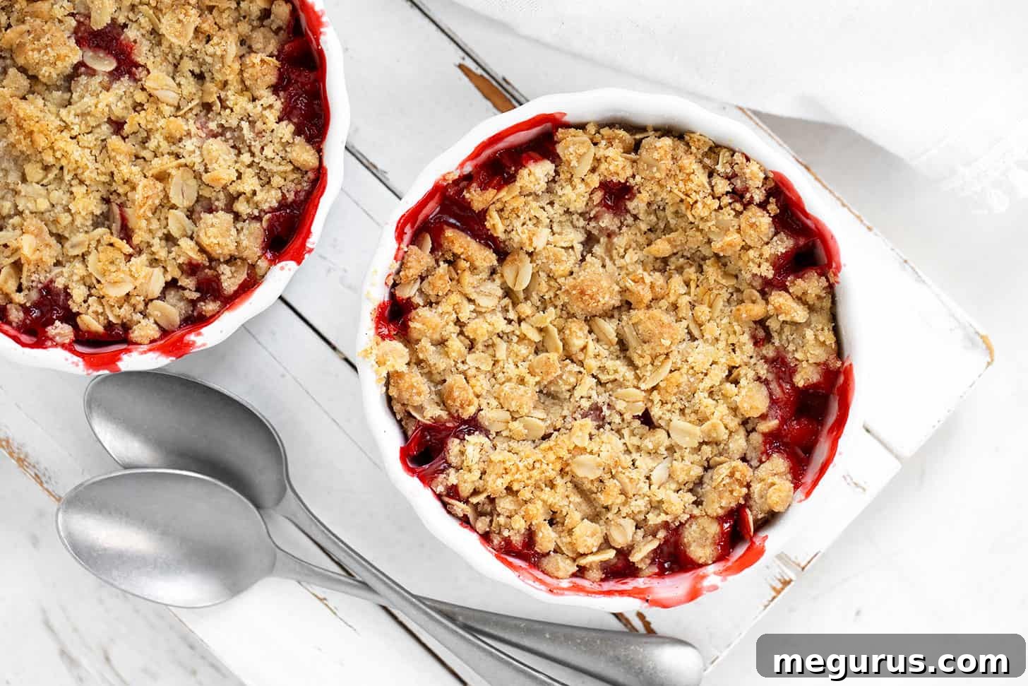 Strawberry crisp served in individual ramekins, ready to enjoy.