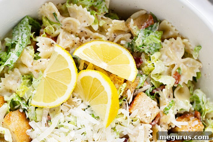 A beautifully presented Caesar pasta salad in a bowl, showcasing the rich textures and colors, ready to be enjoyed.