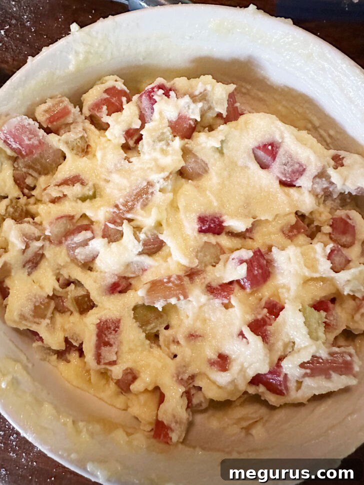 The smooth custard filling mixture after the diced fresh or frozen rhubarb has been added and stirred in.