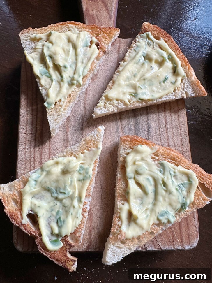 Mustard sauce spread onto toast triangles.