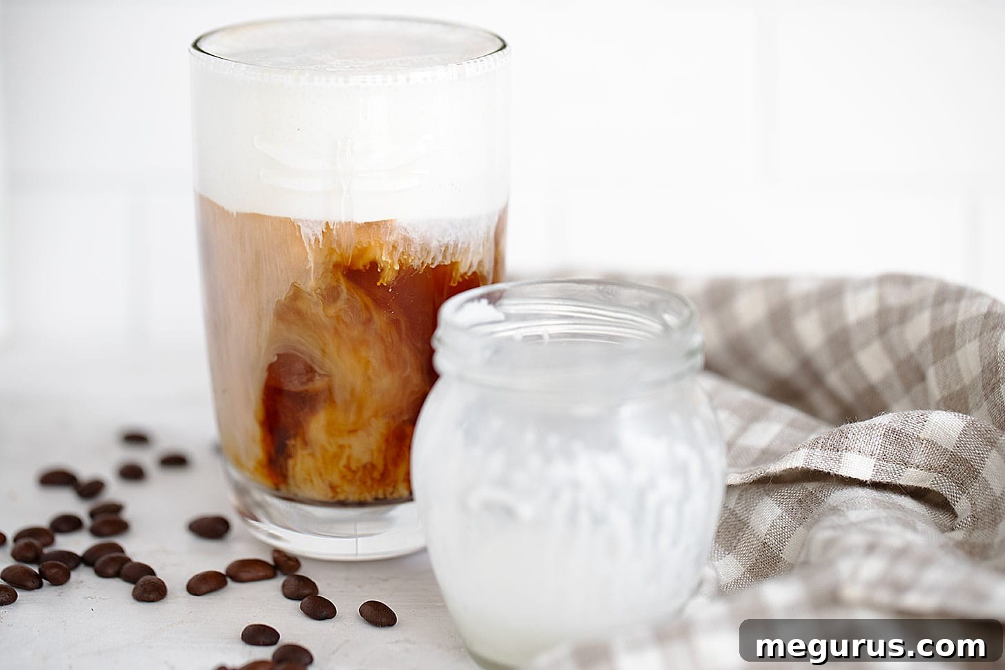 A refreshing glass of homemade Vanilla Sweet Cream Cold Brew topped with rich vanilla sweet cream cold foam.