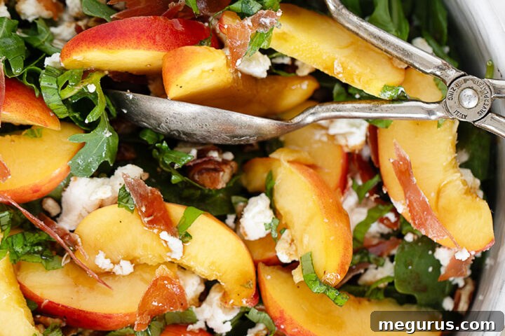 Crispy prosciutto, goat cheese and peach salad in serving bowl.