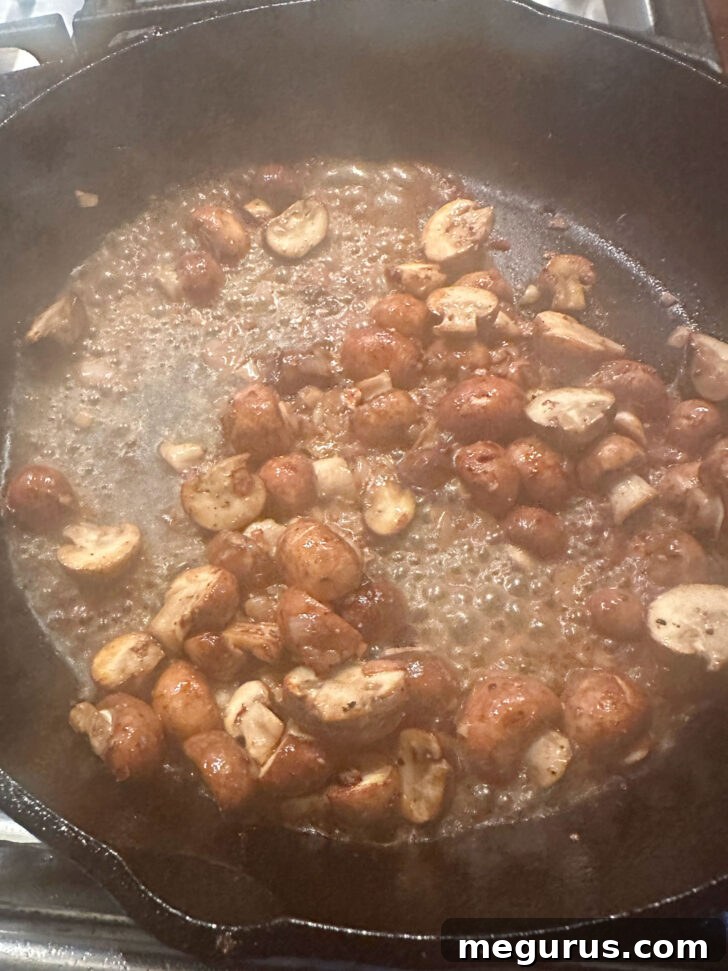 Wine simmering and reducing in the skillet, intensifying the flavors for the Diane sauce.