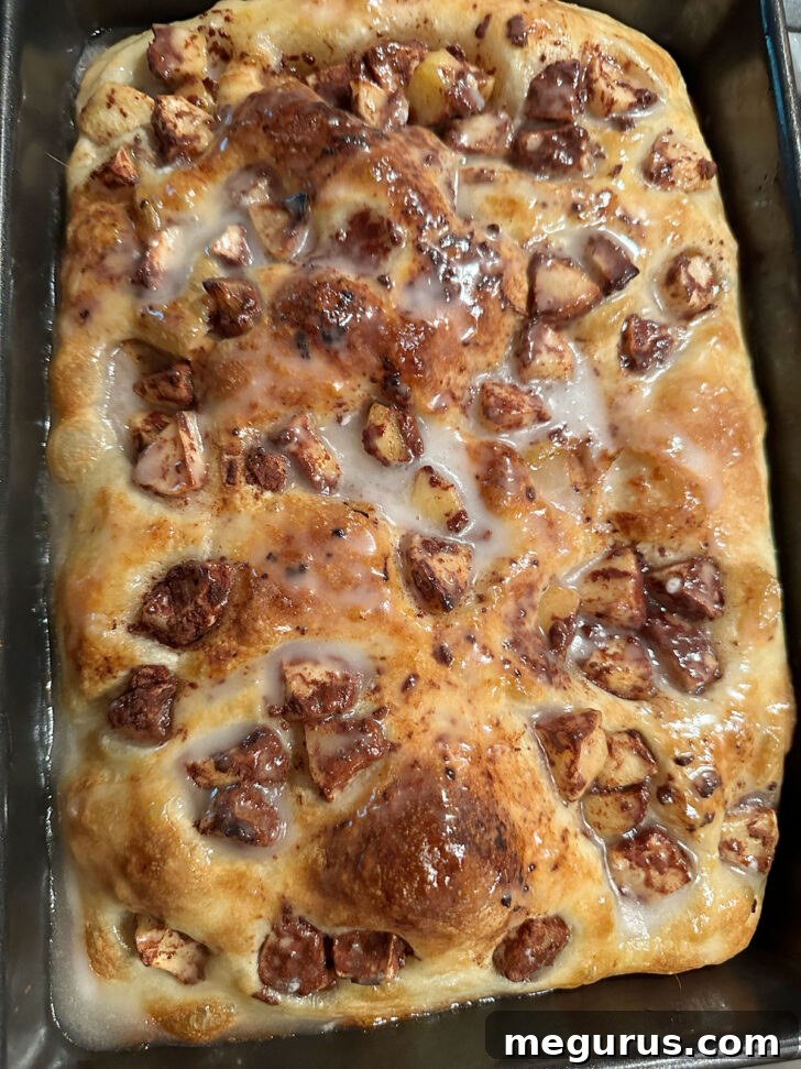 The smooth fritter glaze generously poured and spread over the warm, freshly baked Apple Fritter Focaccia.