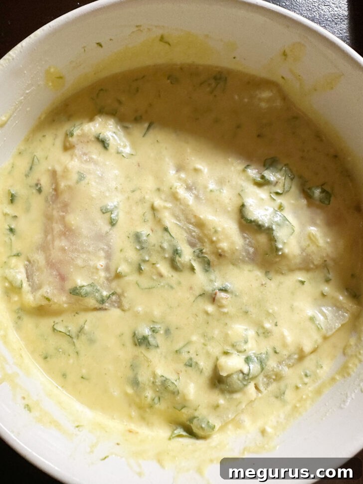 Fish marinating in coconut sauce.