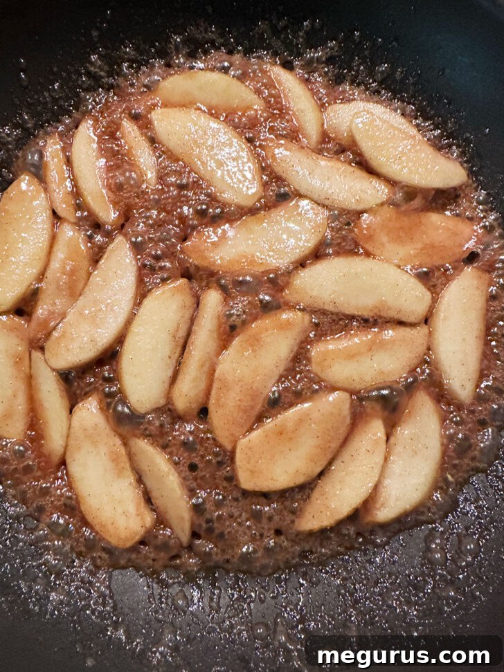Finished apples in skillet.