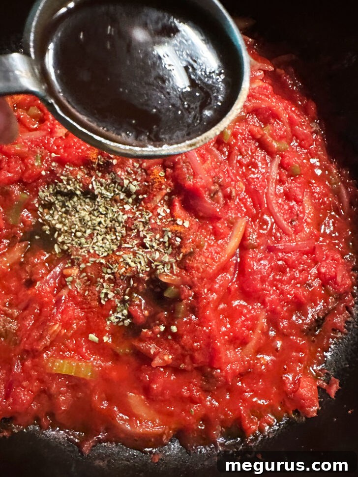 Adding the seasonings to the skillet.