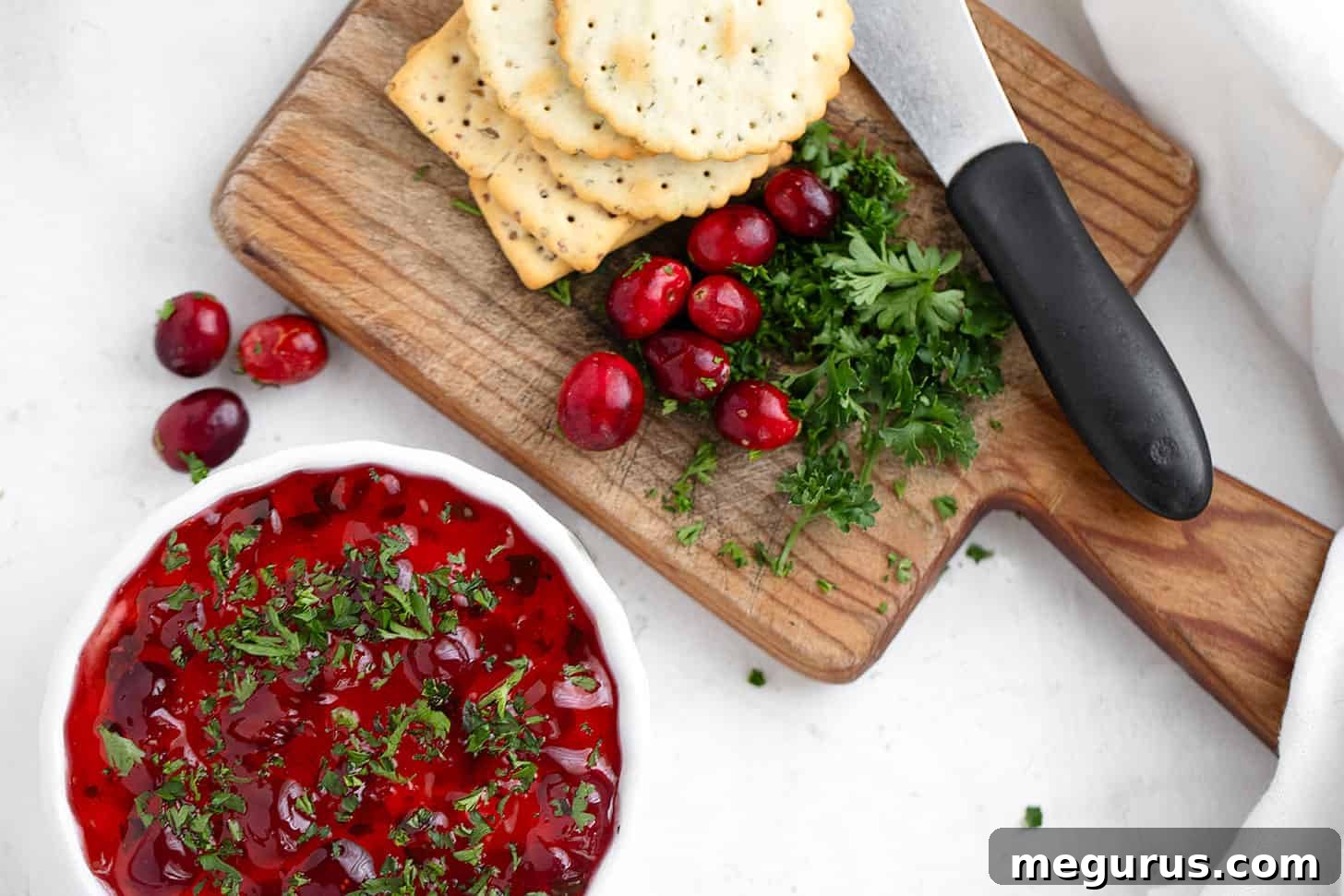 Pepper jelly topped cream cheese dip with crackers.