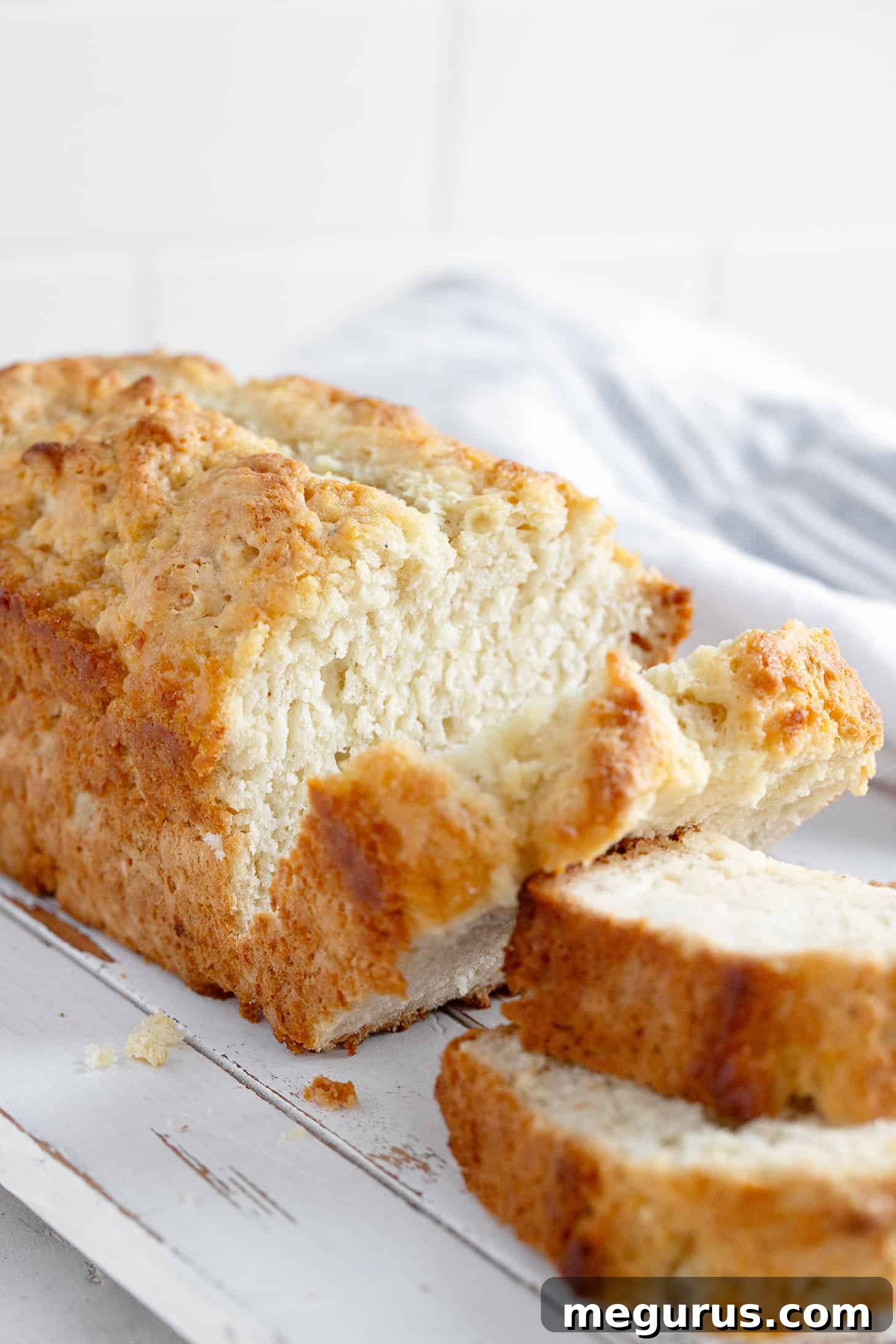 Freshly baked Honey Butter Beer Bread, sliced and ready to be enjoyed.