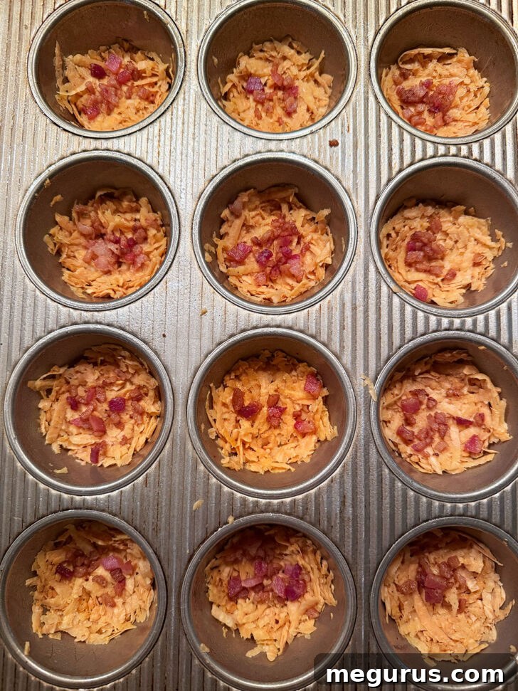 Diced cooked bacon added to the muffin cups as a filling.