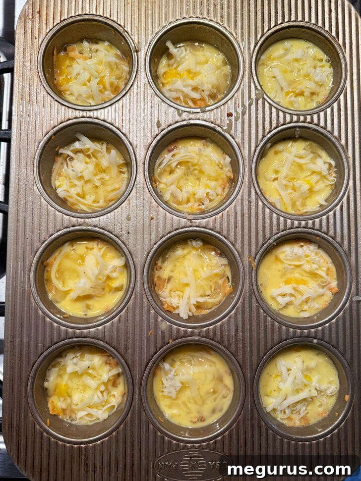Muffin cups filled with sweet potato crust, bacon, cheese, and custard.
