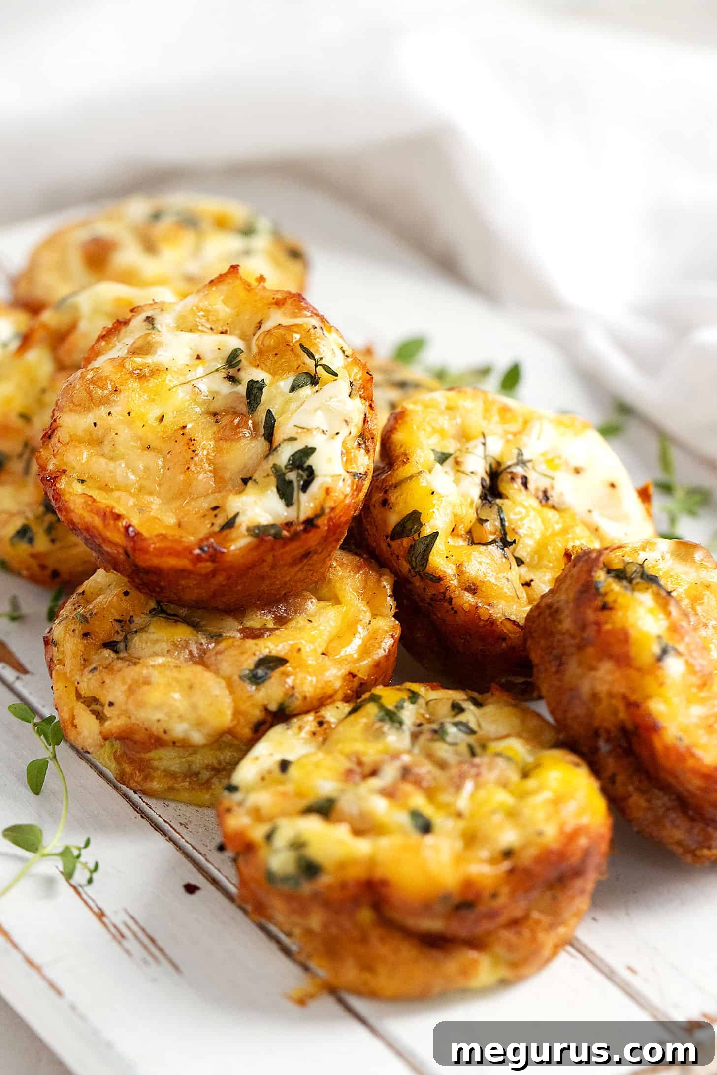 Crustless mini quiche on serving board, featuring sweet potato base.