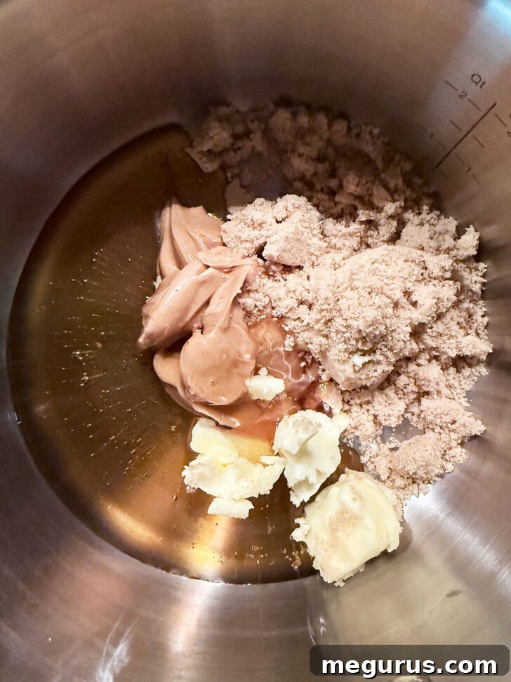 Peanut butter mixture ingredients in saucepan before heating.