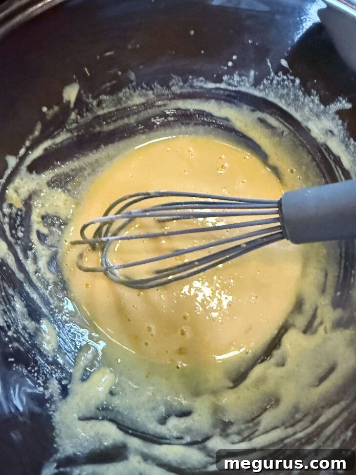 Egg mixture after whisking together, light and foamy.