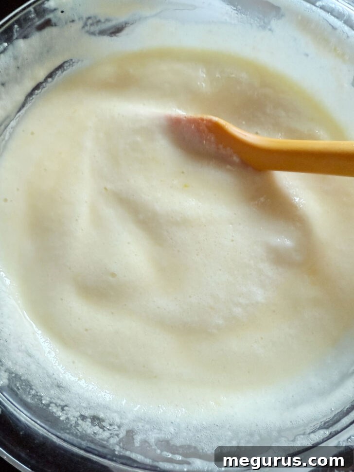 Batter after folding in the egg whites, showing a lighter, aerated texture.