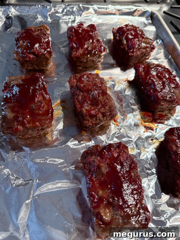 The finished mini meatloaves, golden brown and perfectly glazed after baking, ready to be served.