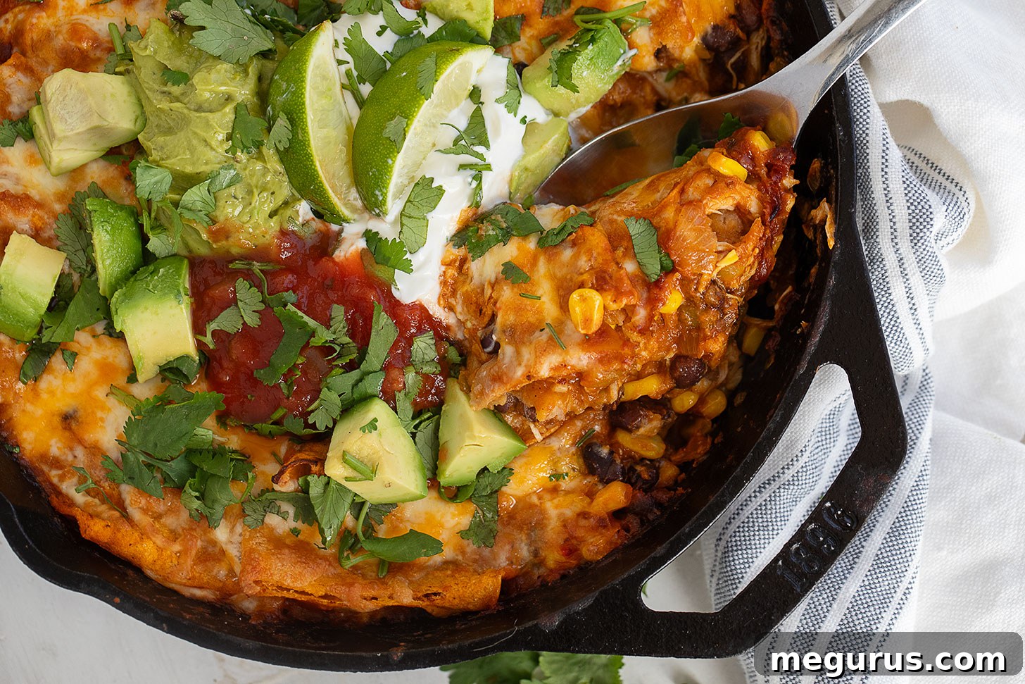 Hearty chicken enchilada skillet in a cast-iron pan, ready to serve.