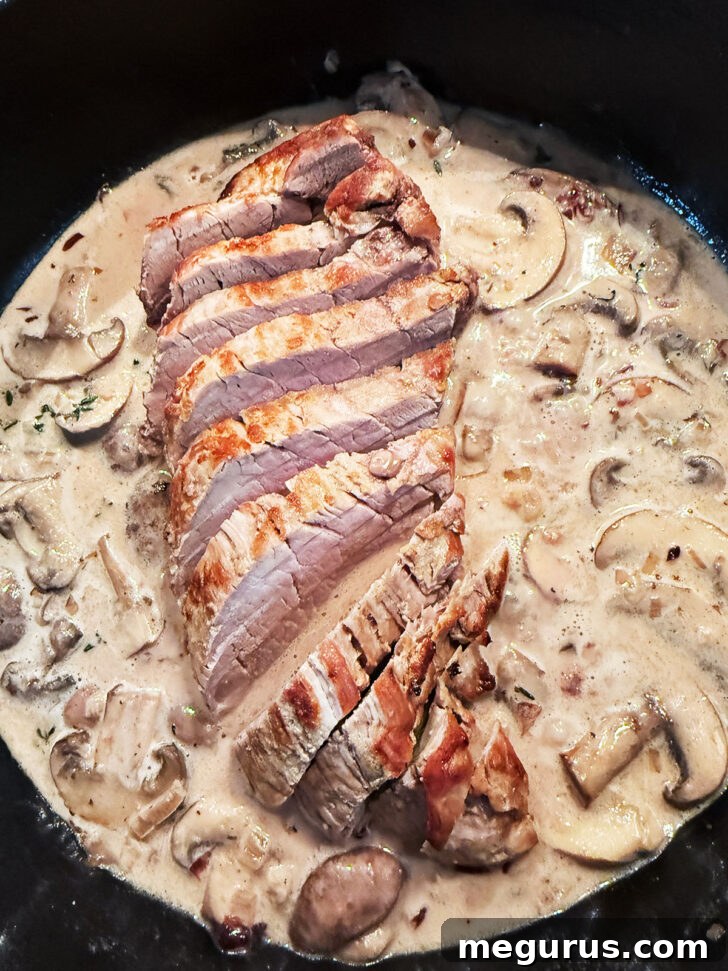 Pork tenderloin sliced and added back to the skillet.