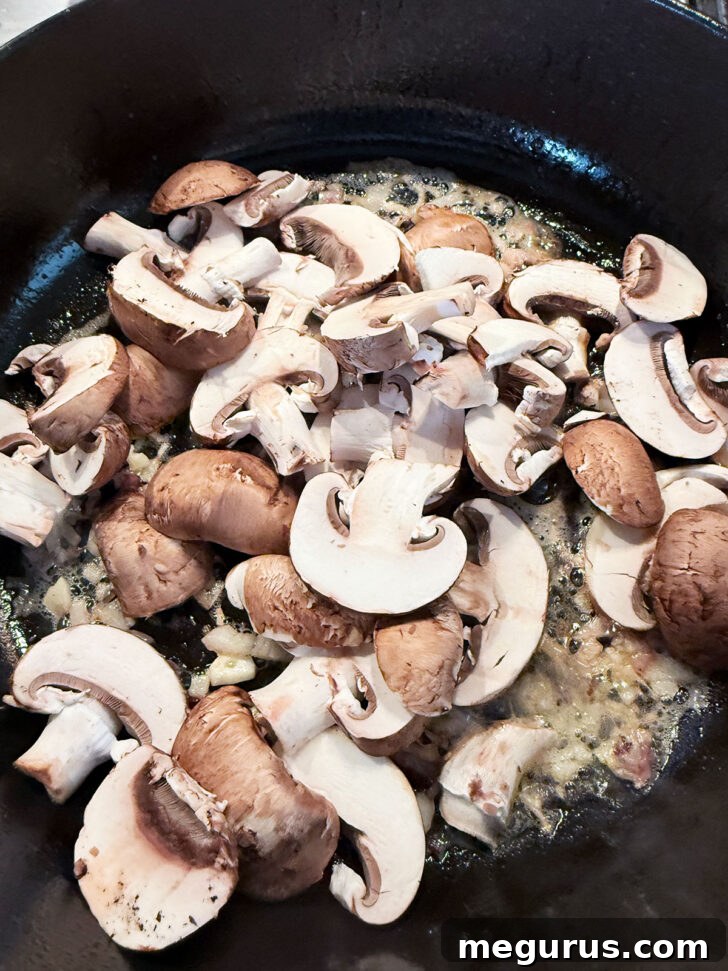 Adding the mushrooms to the skillet.