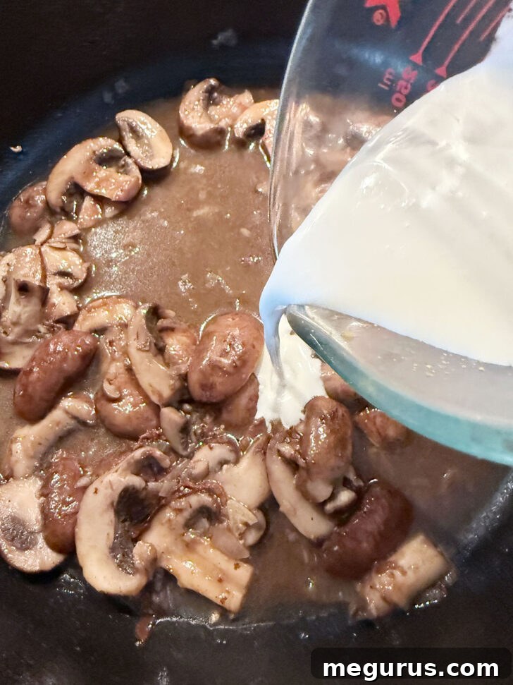 Adding the cream to the skillet.