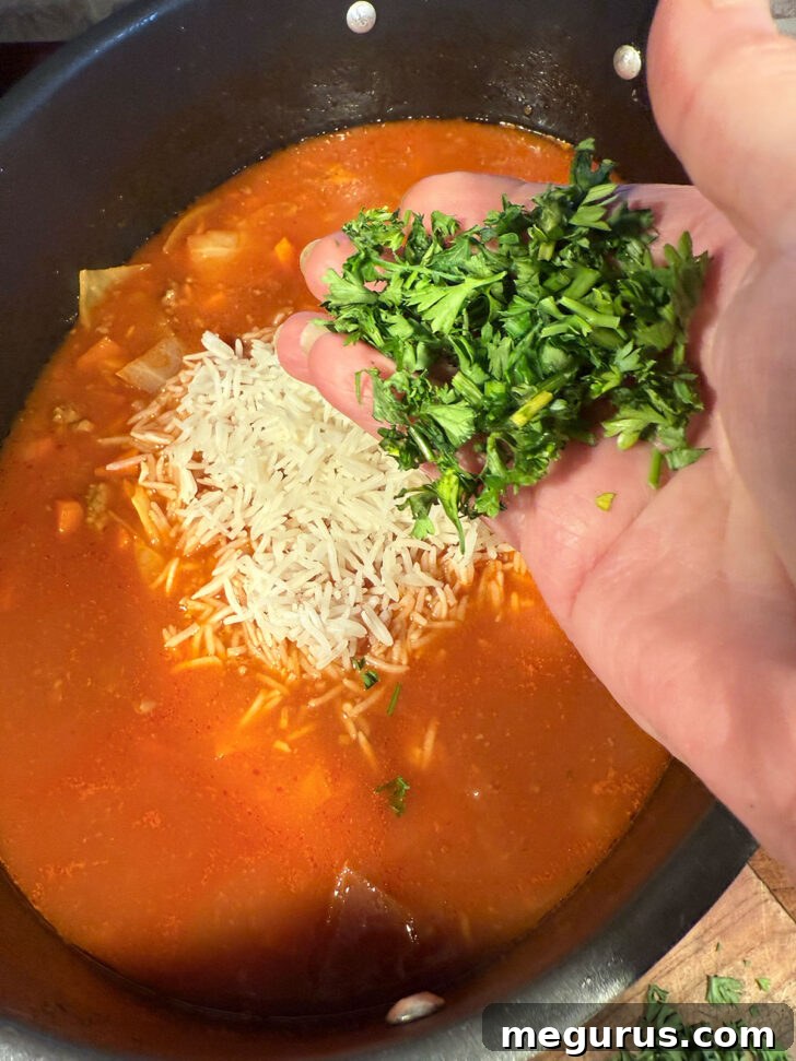 Fresh chopped parsley being added to the soup.