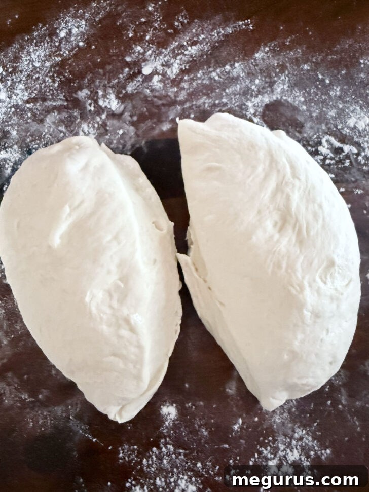 Dividing the dough into two equal pieces.