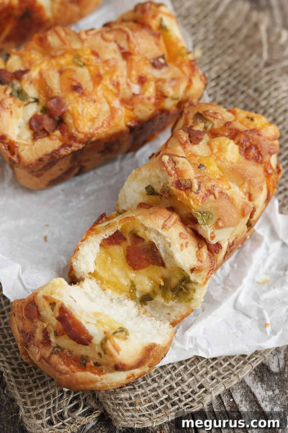 Delicious individual loaded baked potato pull apart bread in a pan.