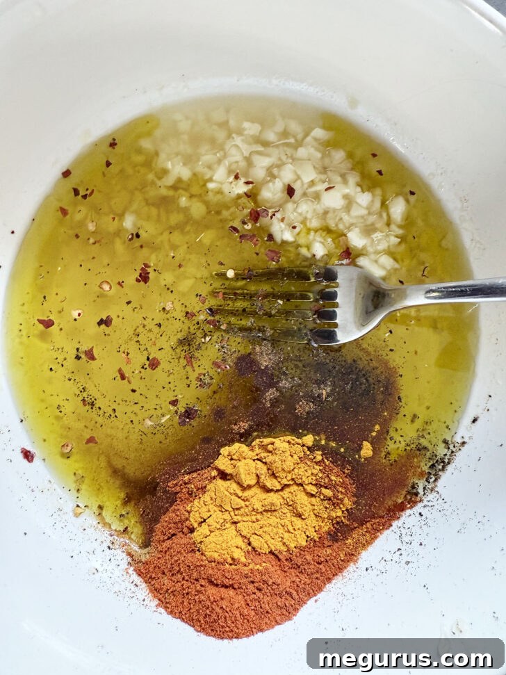 Chicken shawarma marinade ingredients in a small bowl before mixing.