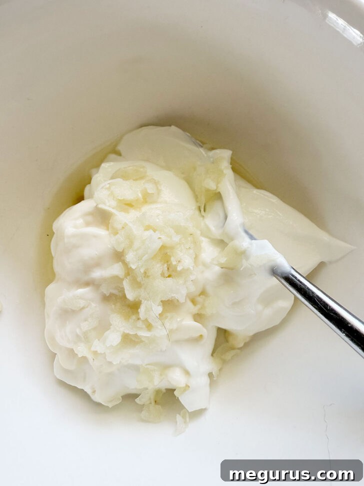 White sauce ingredients in a small bowl before mixing.
