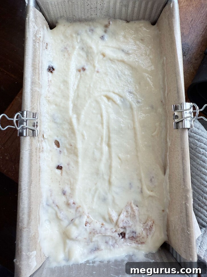 The final layer of batter smoothed over the top in the loaf pan.