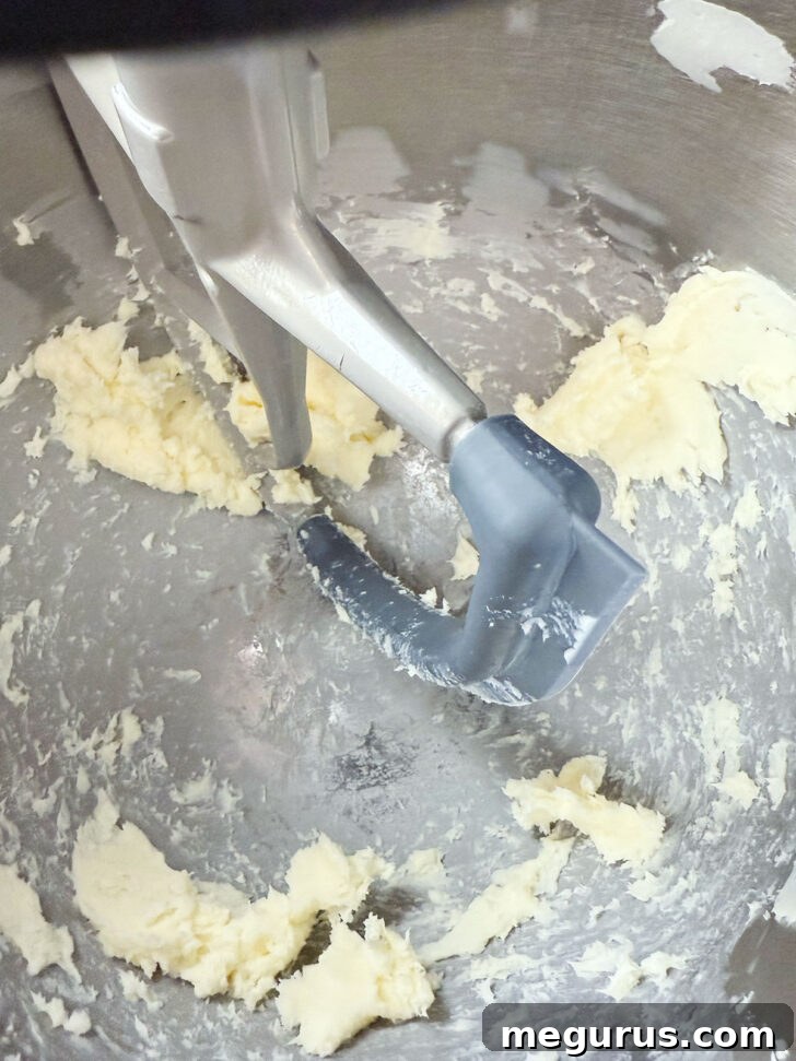 Beating cold butter in a mixing bowl until softened.