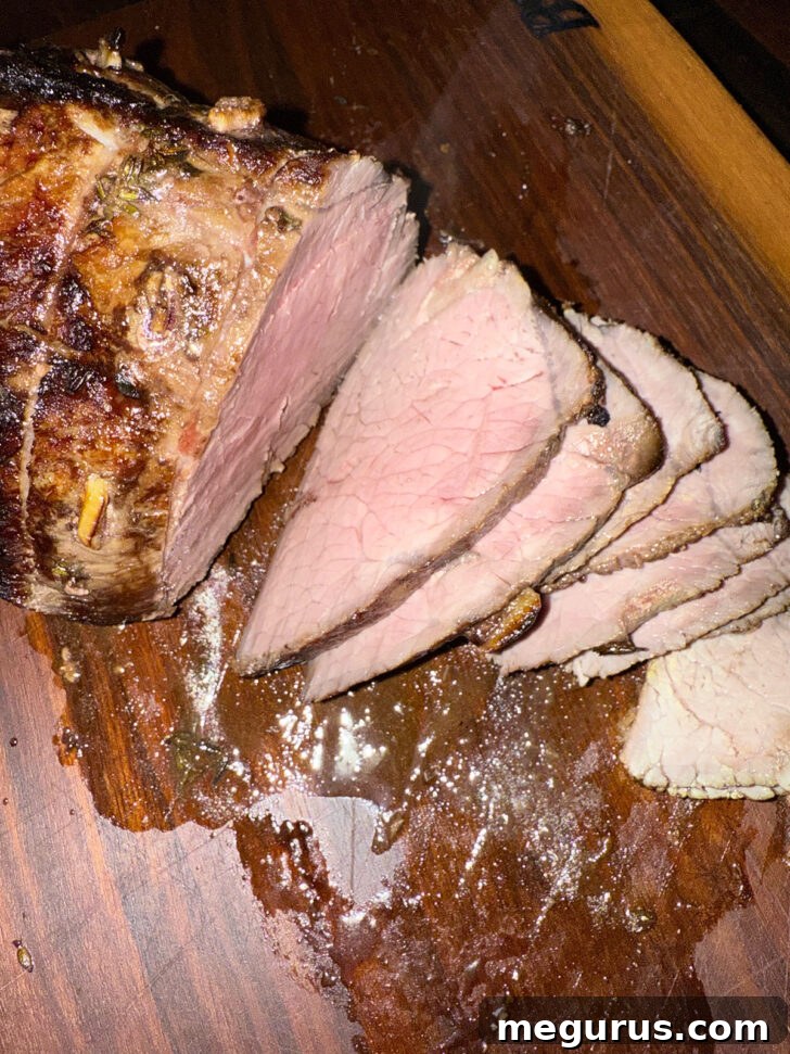 Sliced roast on a cutting board.