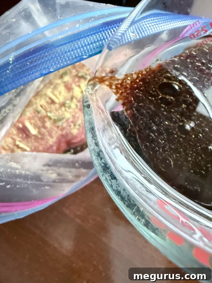 Pouring the marinade over the roast in a plastic zipper bag.