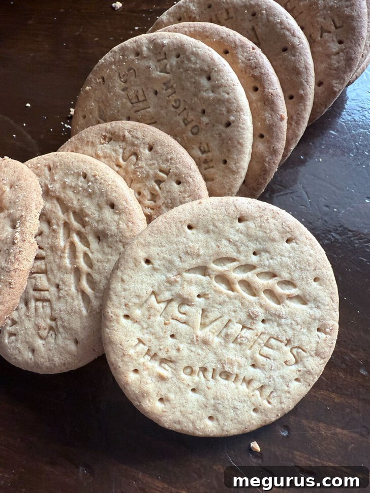Fifteen Digestive biscuits laid out on a clean counter, ready for crushing, showcasing their golden-brown color and simple design.