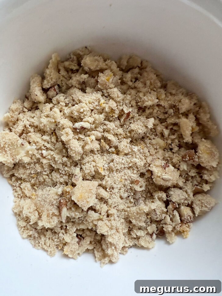 A close-up shot of the crumb topping mixture, perfectly blended and ready to be sprinkled over the coffee cake batter.