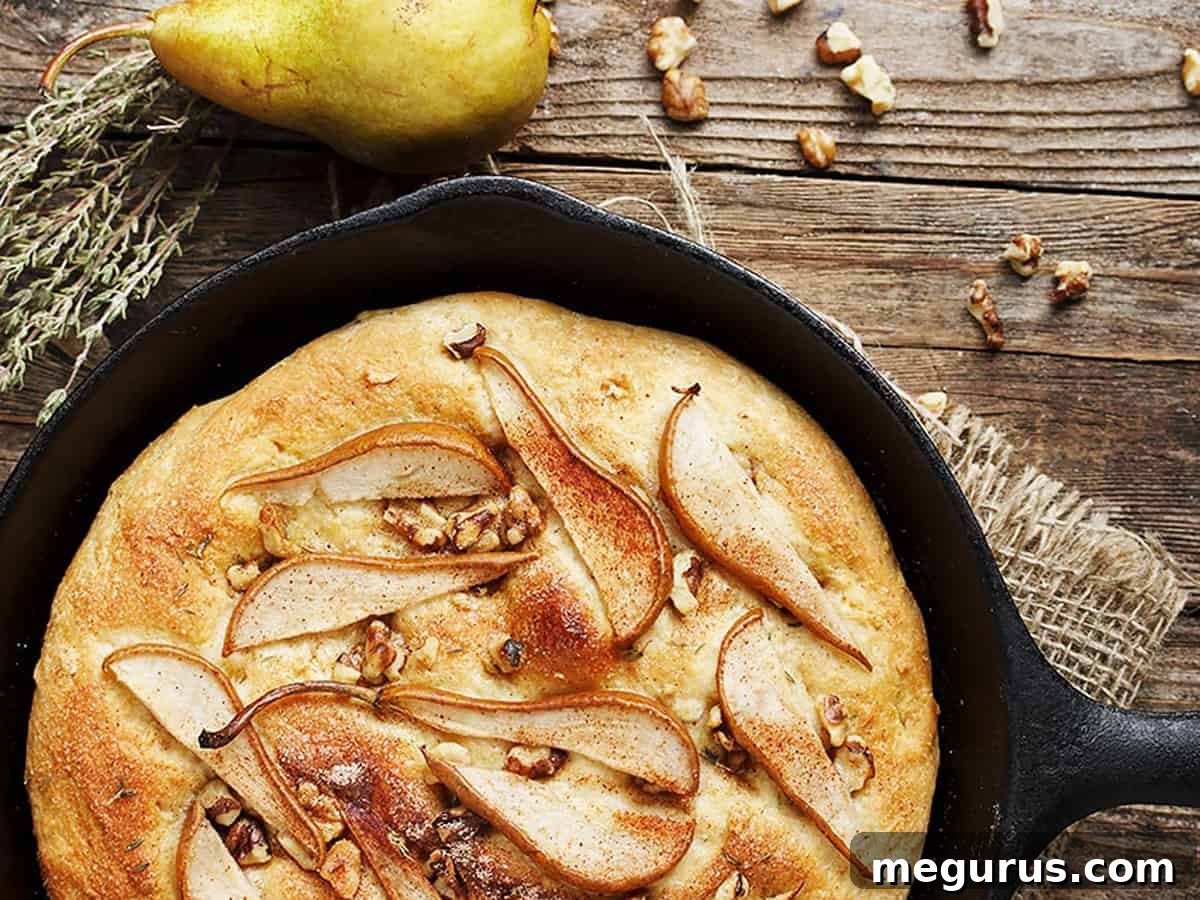 Delicious Pear and Walnut Focaccia baked in a cast iron skillet, ready to be served