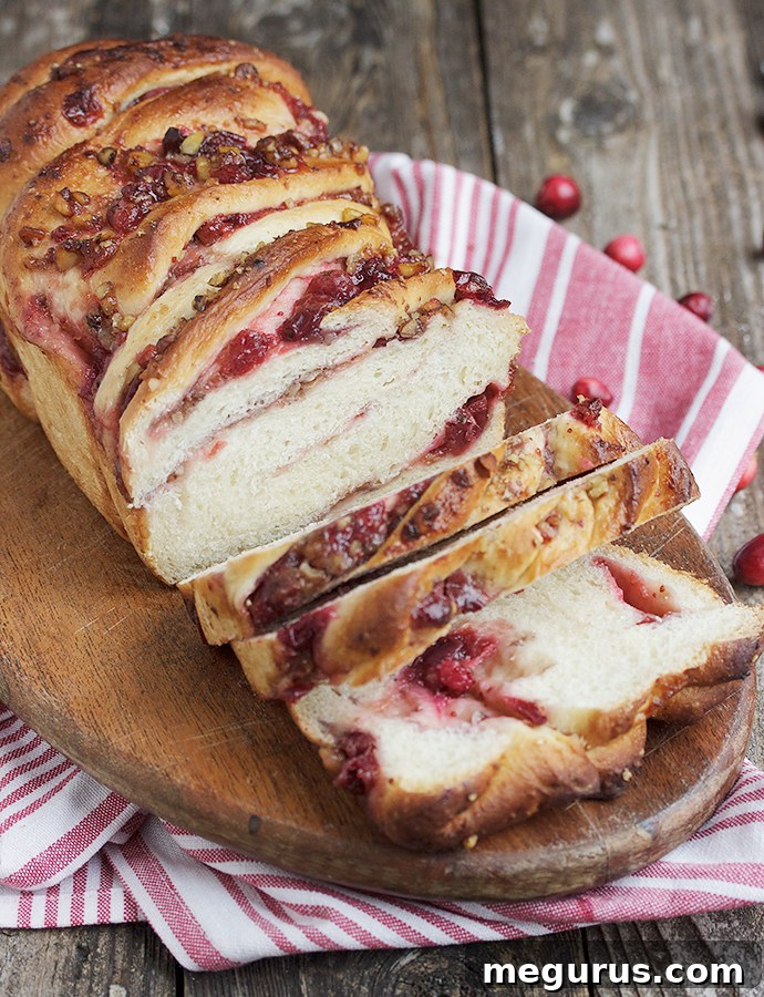 A whole loaf of Cranberry Walnut Swirl Bread, showcasing the golden-brown crust.