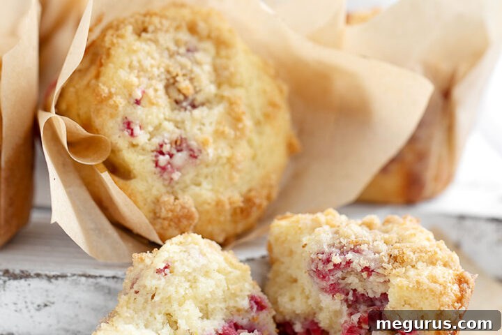 Raspberry lemon muffins on serving board.