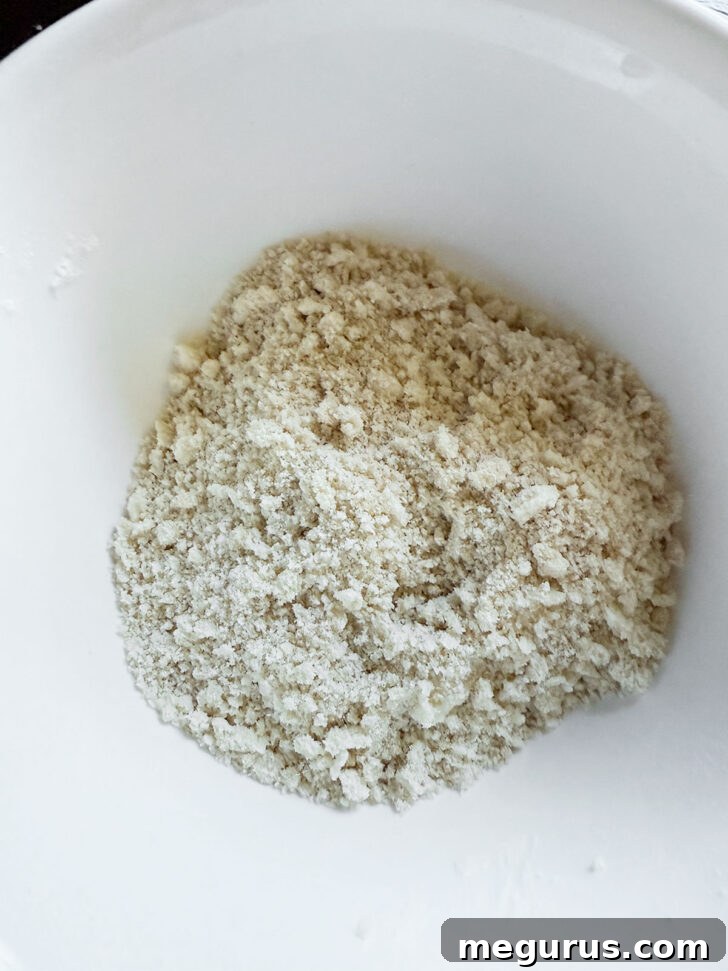 Crumb topping after rubbing the butter into the dry ingredients, showing a coarse mixture.