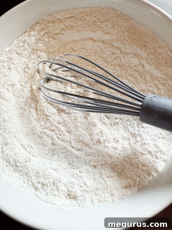 Dry ingredients for the muffins whisked together in a bowl.