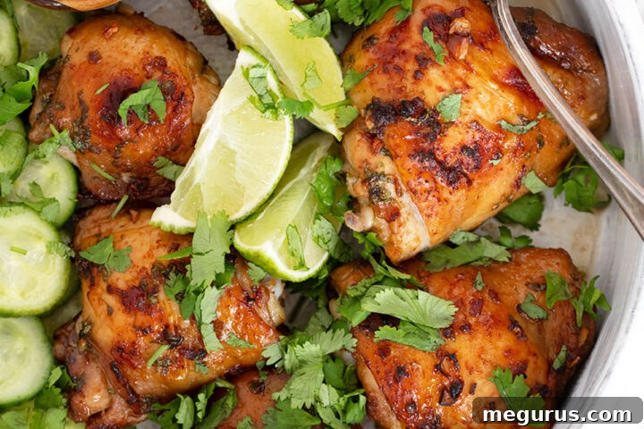 Vietnamese Chicken Thighs ready for cooking in a baking dish, glistening with marinade.