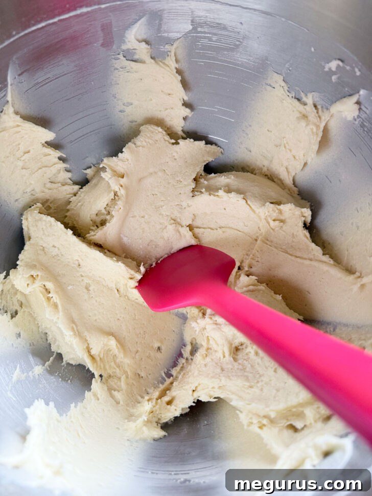 Finished cake batter in the mixing bowl, ready for transfer.